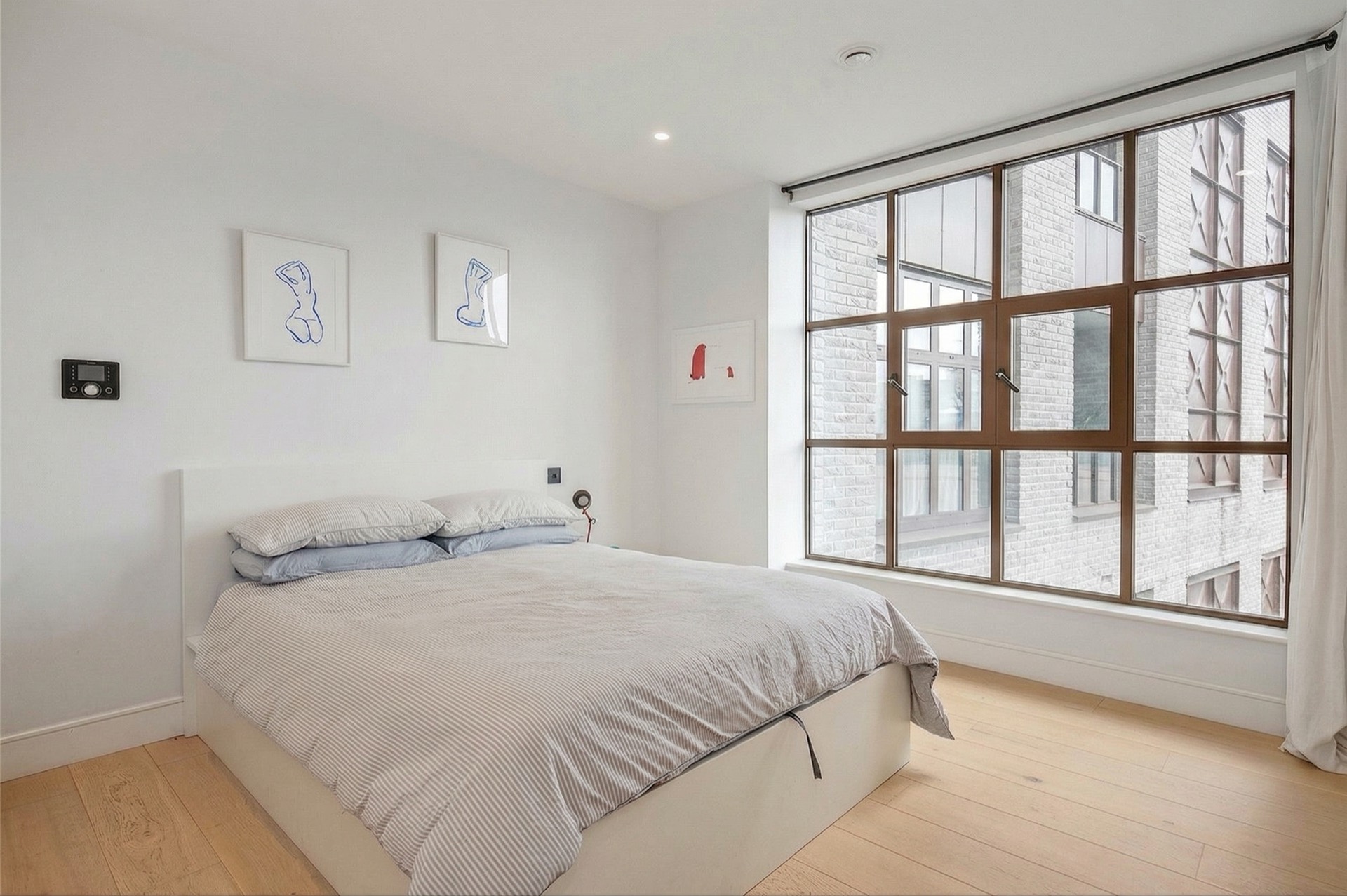 Bedroom with warehouse-style window