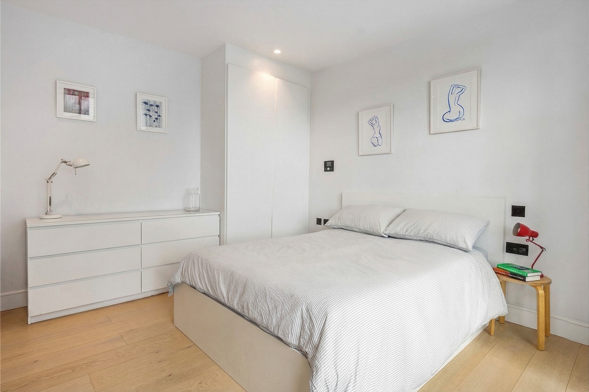 Bedroom with built-in wardrobe and chest of drawers