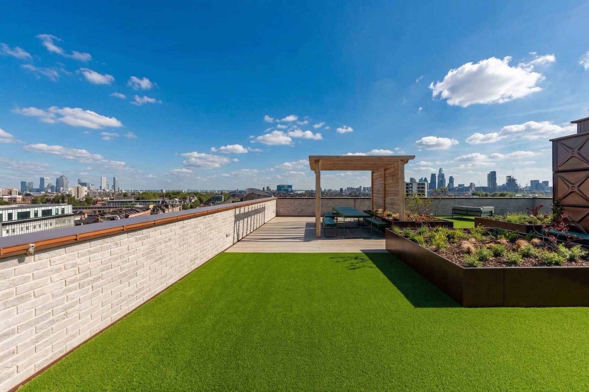 Rooftop terrace with lawn and City skyline