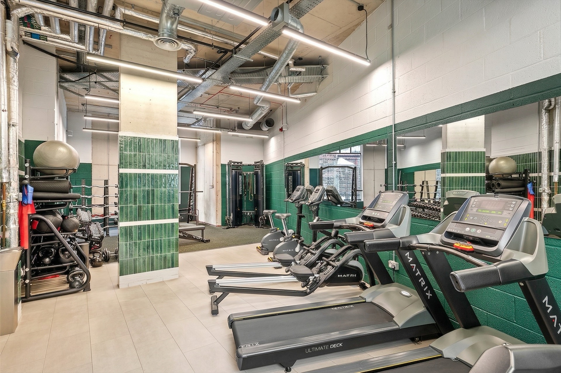 Residents' gym with green tiled columns