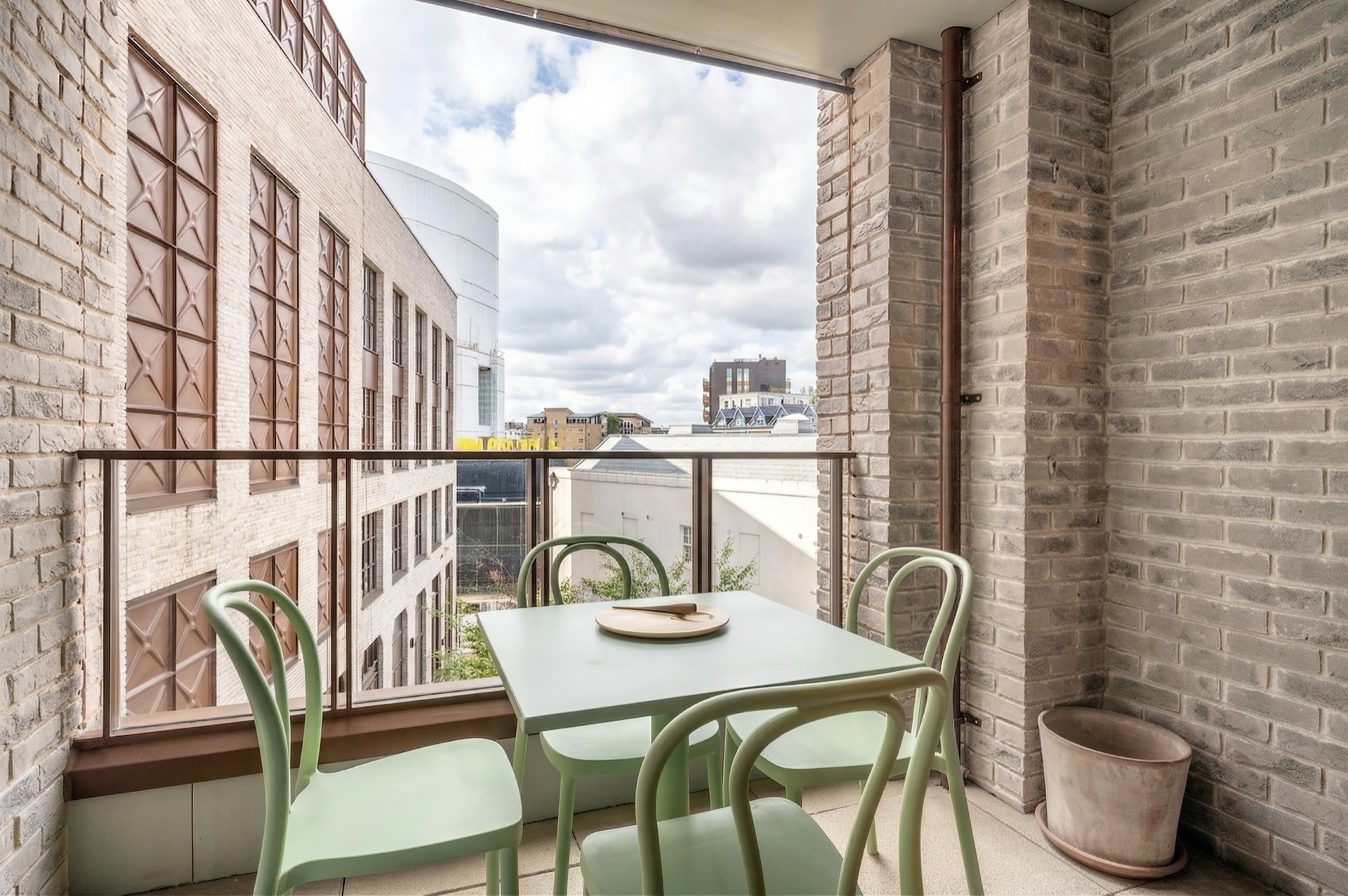 Private balcony with café table, looking into the courtyard
